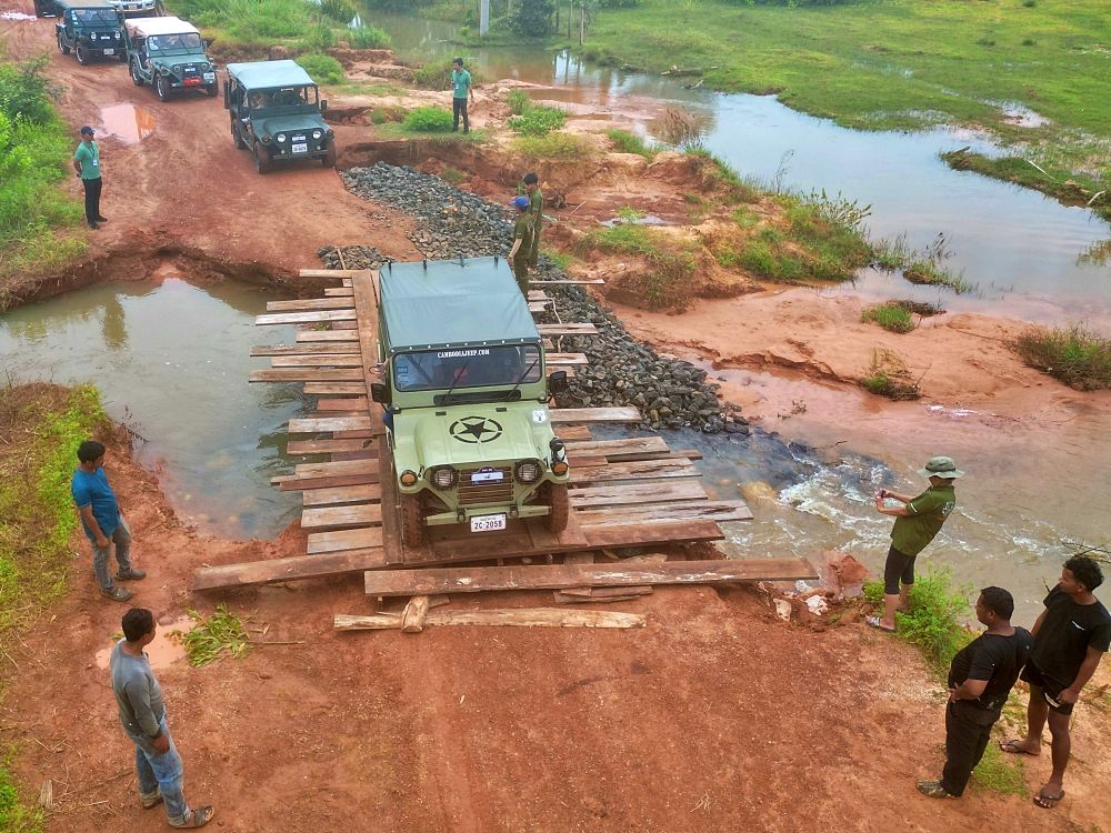 Jeep driving over the bridge