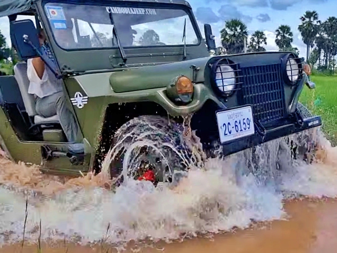 Jeep driving flooded road