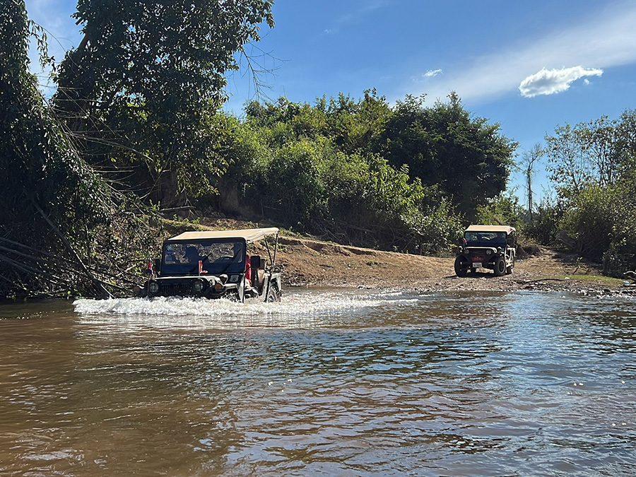 Jeeps crossing the river